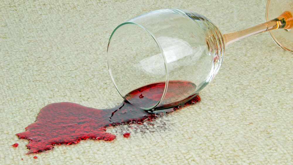 Spilled red wine on the carpet