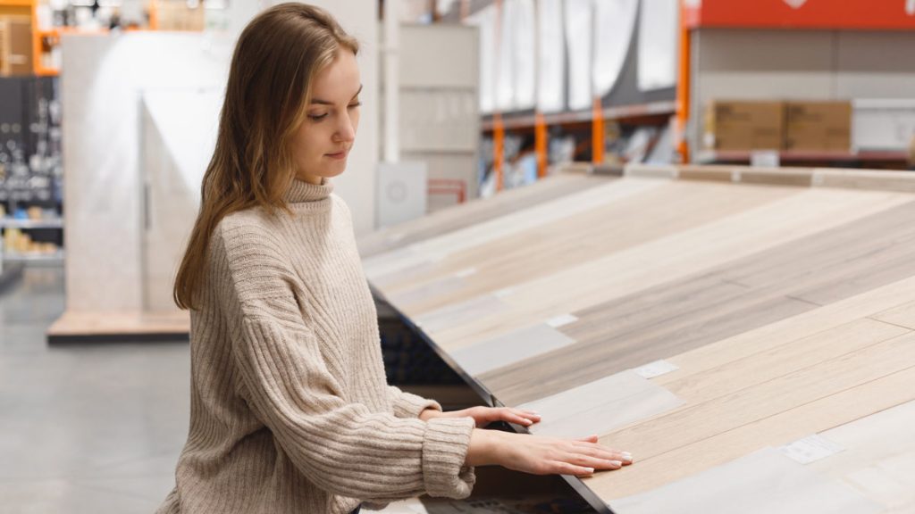 Young woman choosing flooring type