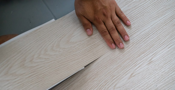 Installing vinyl laminated flooring