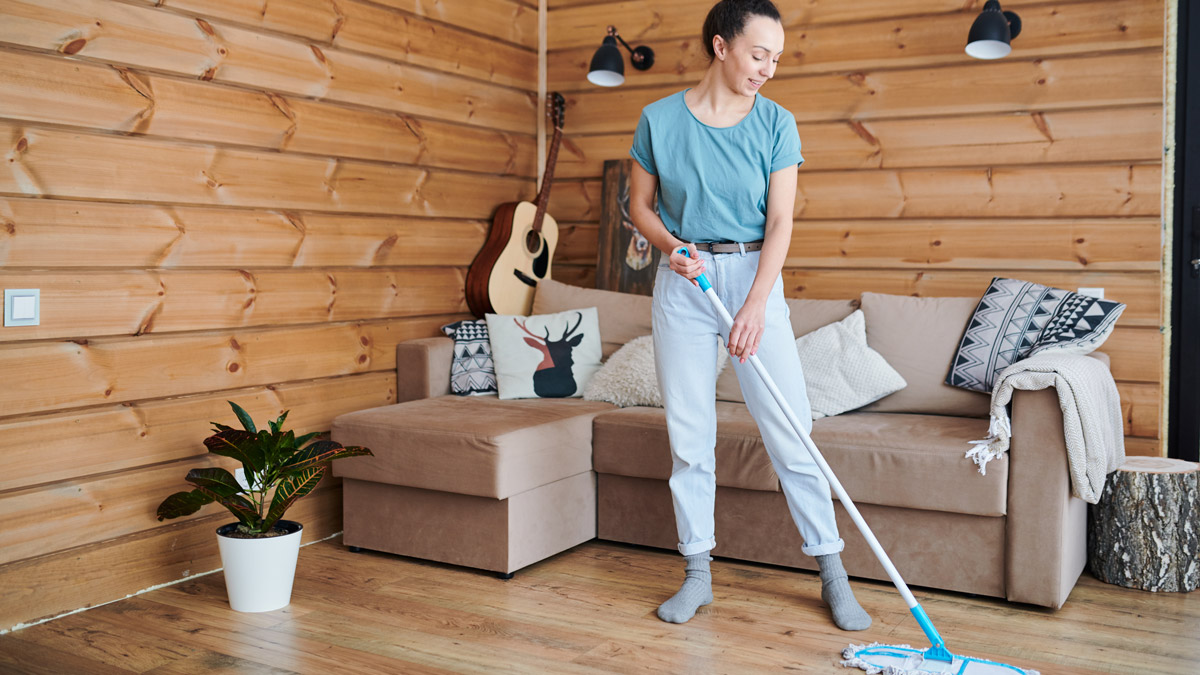 Woman cleaning the vinyl flooring