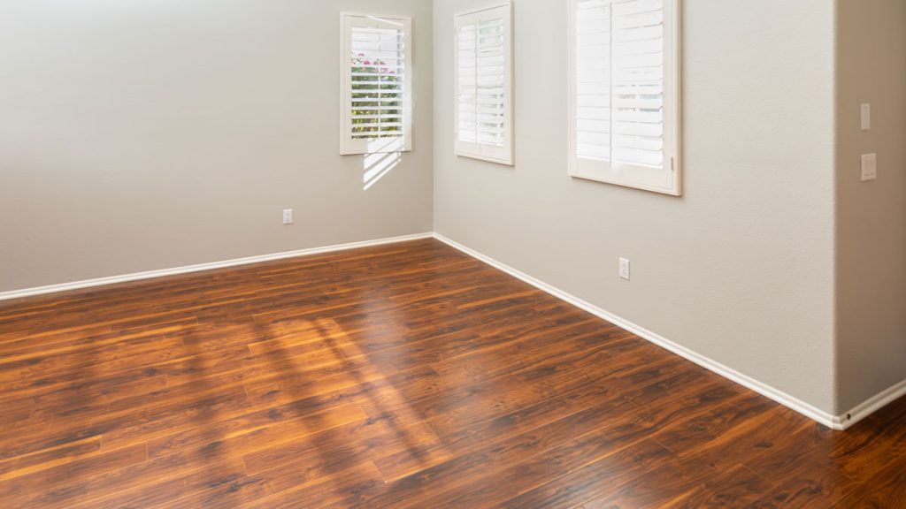 Room with newly installed brown laminate flooring