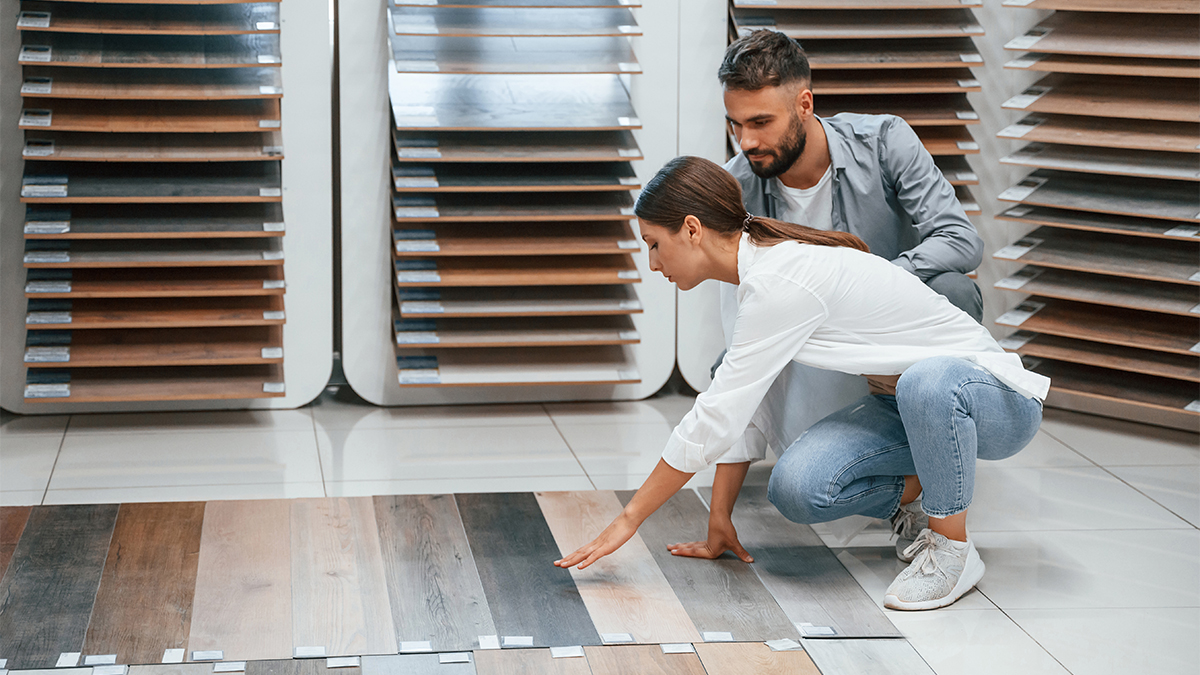 Couple deciding about laminate flooring options