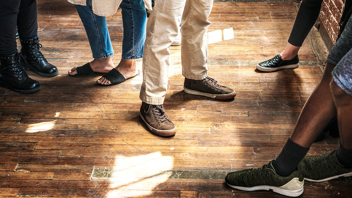 Group of people standing on the laminated floor