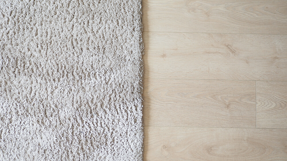 Seamless carpet texture background on wooden floor