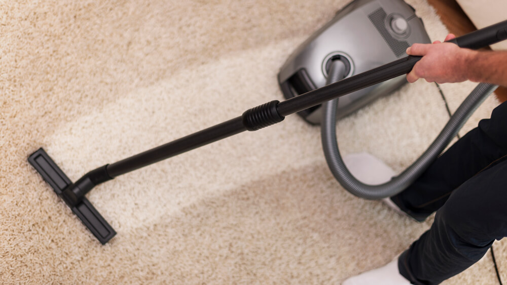 Vacuuming carpet