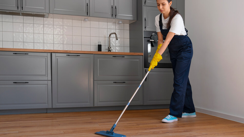 Full shot of a woman mopping home flooring