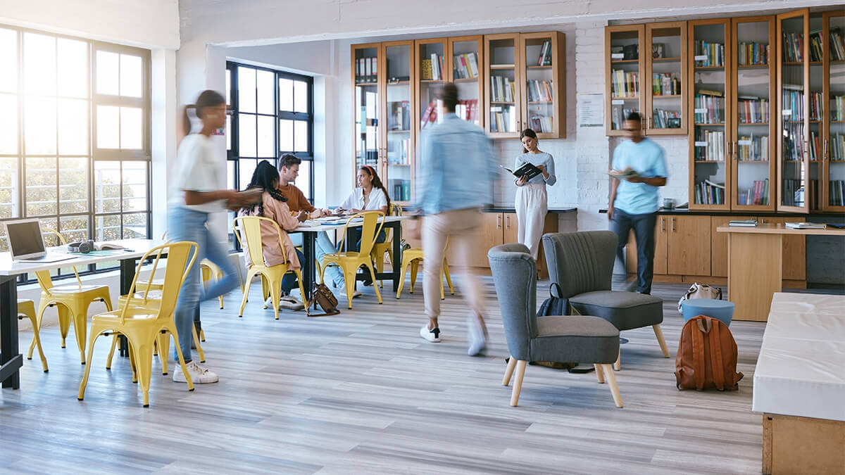 Students studying in the university library with laminate flooring