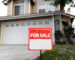 House with yard and sign of for sale