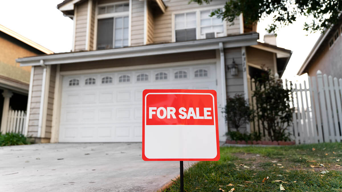 House with yard and sign of for sale