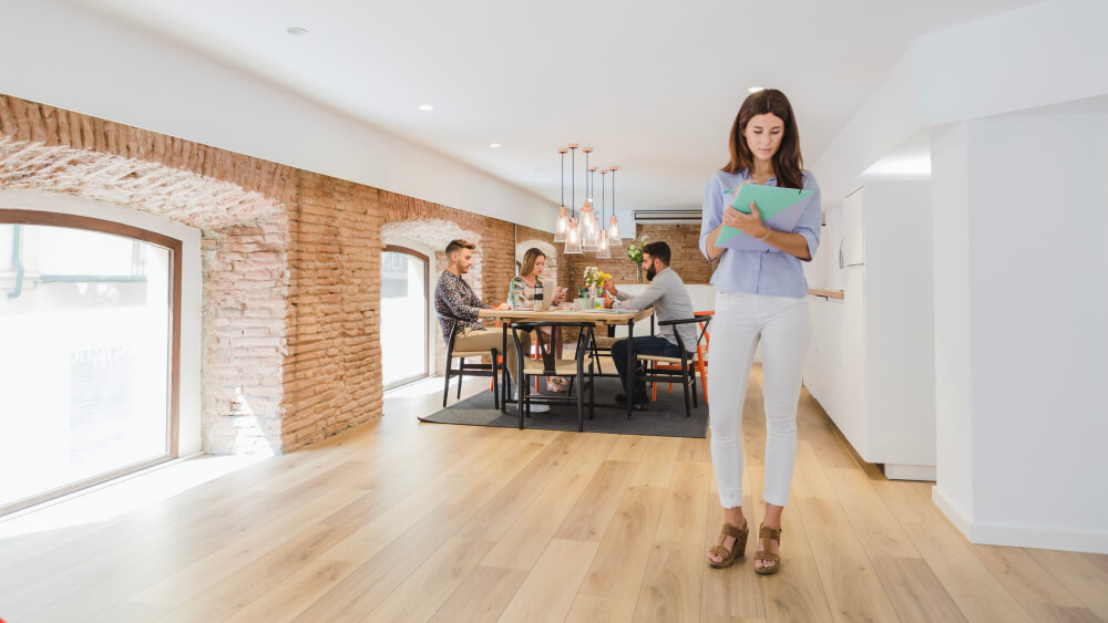 Woman in office with laminate flooring