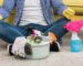 Man sitting on floor after cleaning carpet